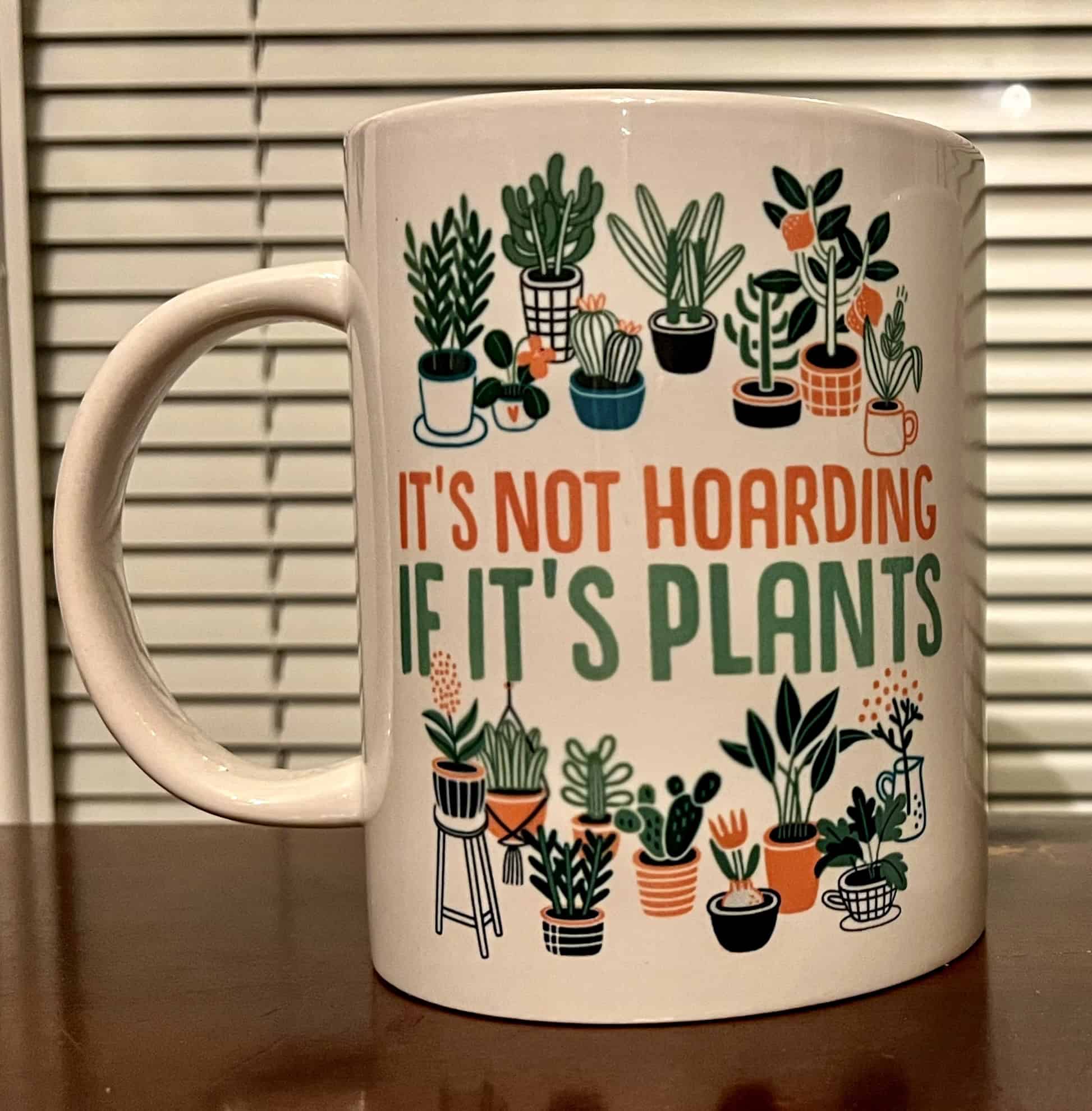 Green potted plant mug with plants and quote about indoor gardening.