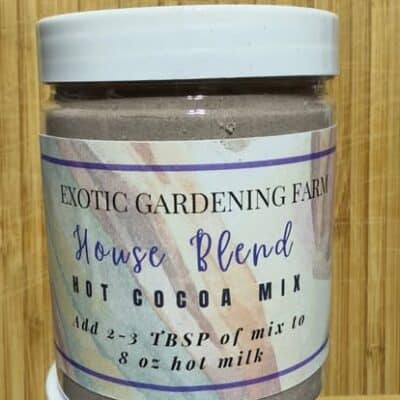 Exotic Gardening Farm House Blend hot cocoa mix in a 6-ounce jar with white lid and product label