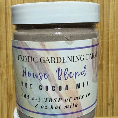 Exotic Gardening Farm House Blend hot cocoa mix in a 6-ounce jar with white lid and product label